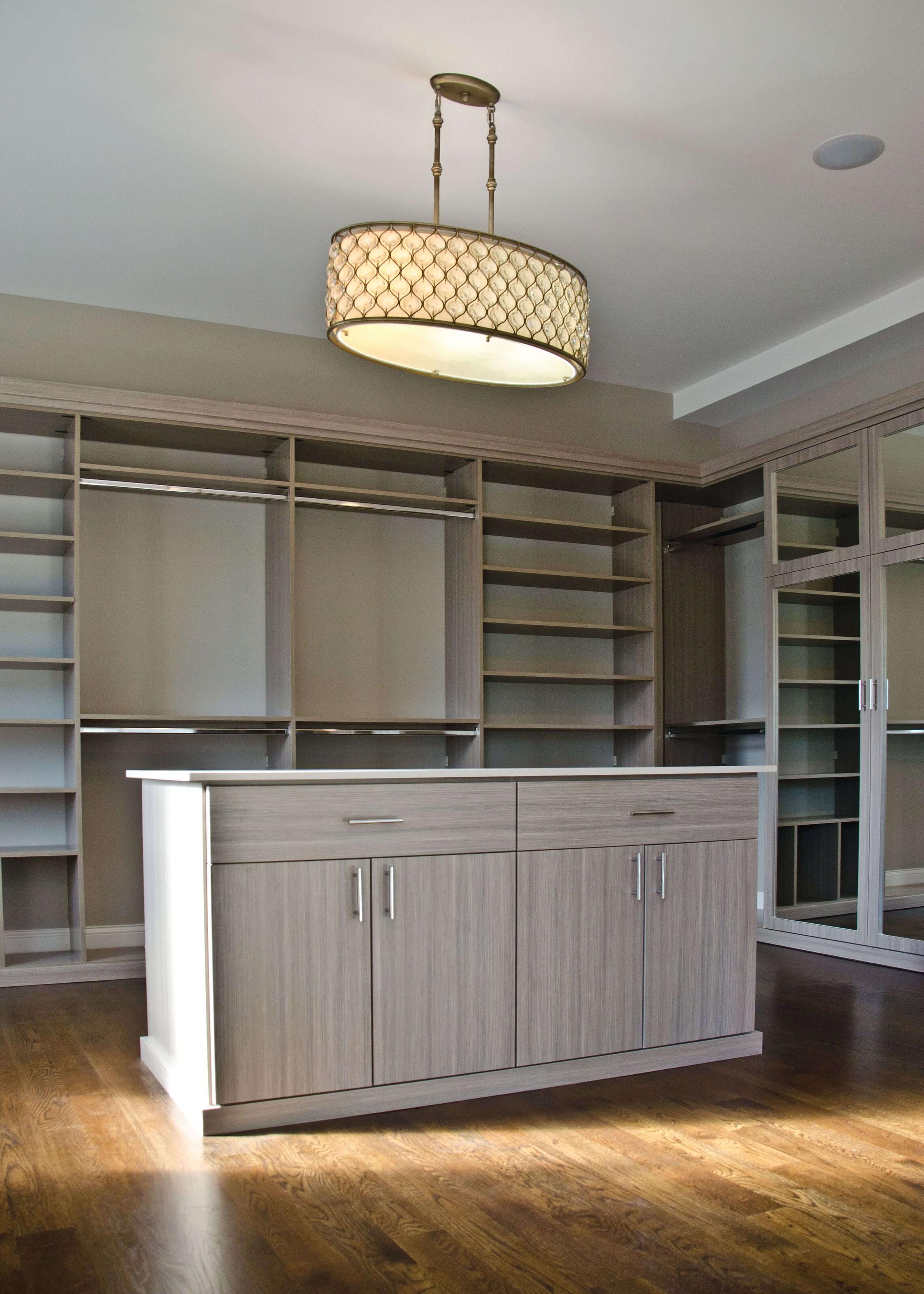 Walk-in closet with closet rods and center island